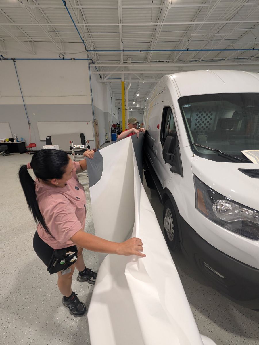 Van door panel — printed vinyl squeegeed down by hand