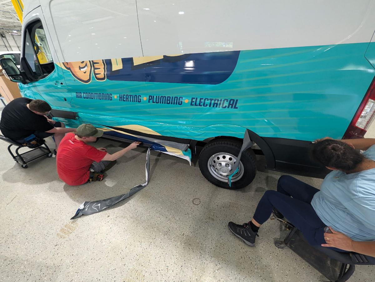 Service body — full-color side graphics fitted around the wheel arch