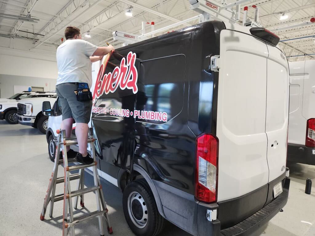 Cargo van — rear and side graphics worked from a ladder