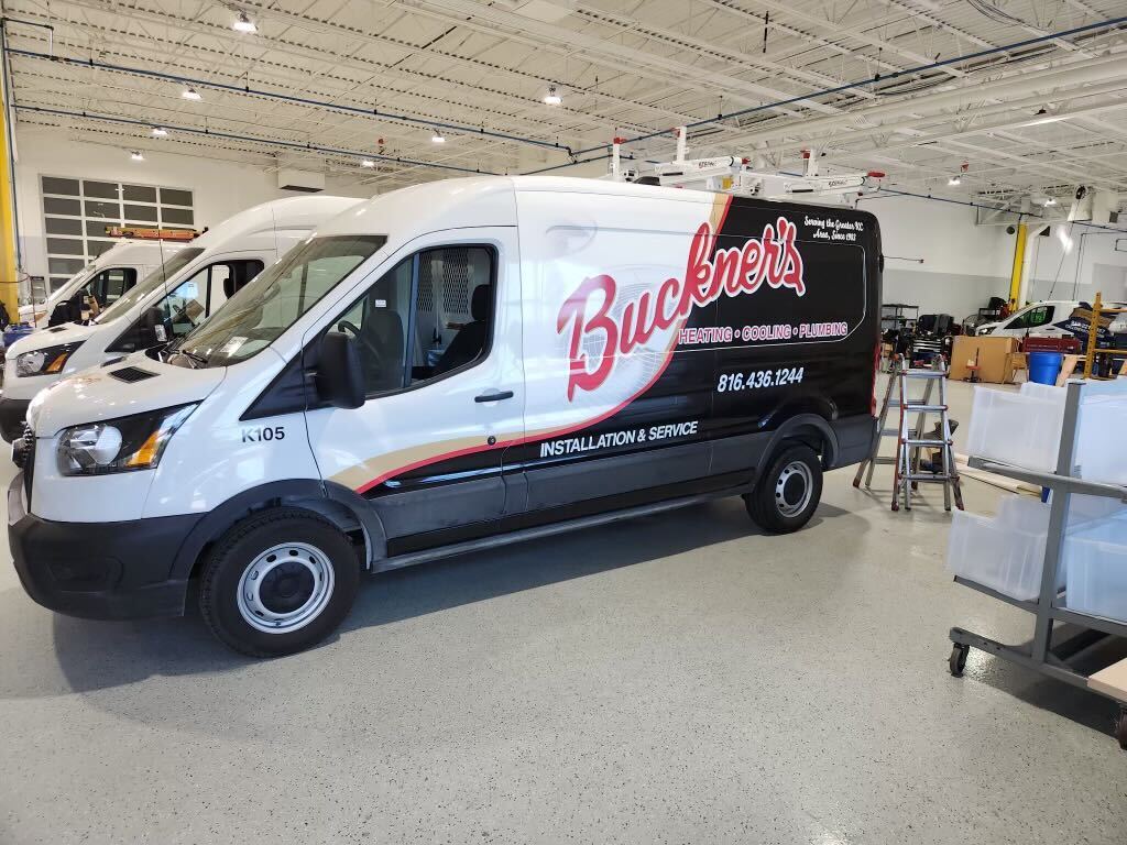 Finished service van — logo, lettering and phone number in place