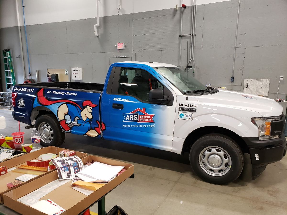 Service pickup with door graphics and lettering